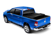 Load image into Gallery viewer, Lund 19-23 RAM 1500 (6.5ft Bed w/o RamBox Cargo Mgmt) Genesis Elite Tri-Fold Tonneau Cover - Black